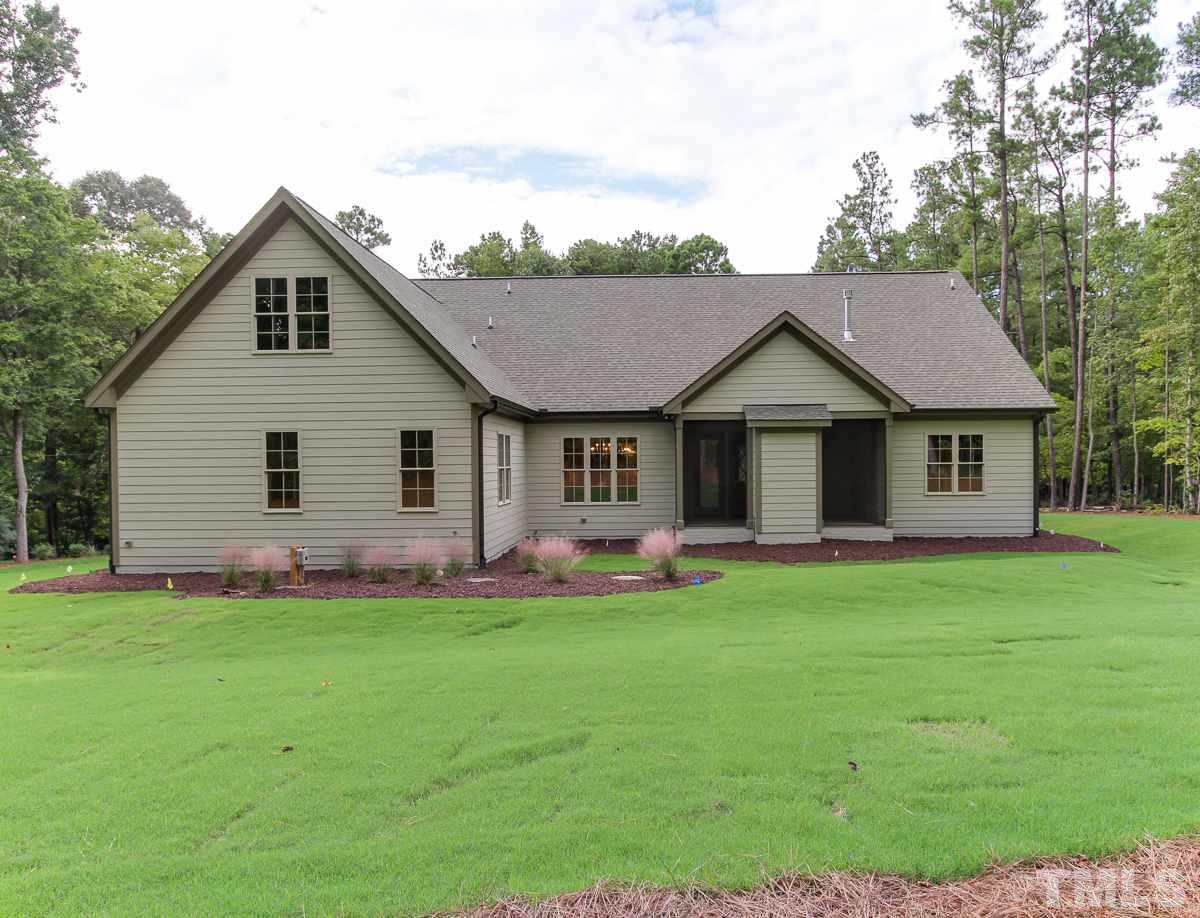 128 Chatterson Drive Raleigh, NC 27615 - Photo 24 of 25 a front view of a house with a garden