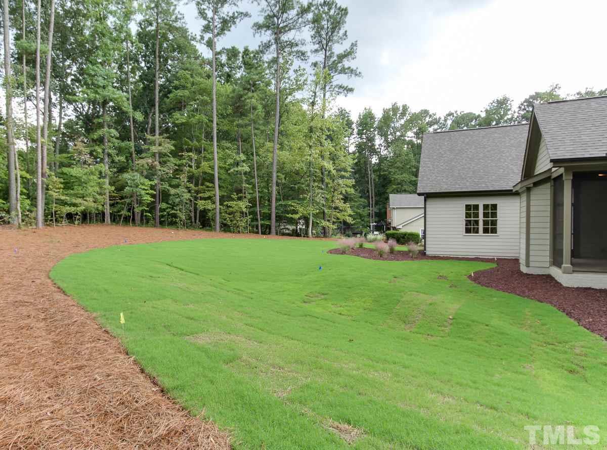 128 Chatterson Drive Raleigh, NC 27615 - Photo 25 of 25 a view of a house with a yard and sitting area