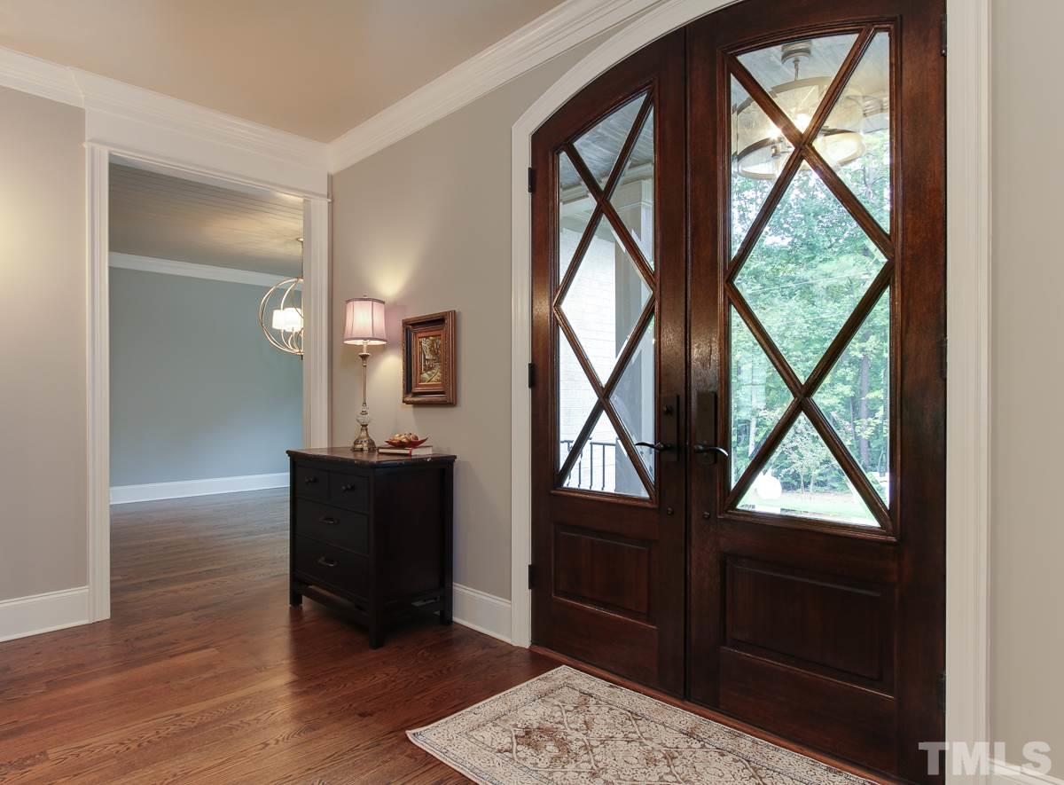 128 Chatterson Drive Raleigh, NC 27615 - Photo 3 of 25 a living room with a large window and wooden floor