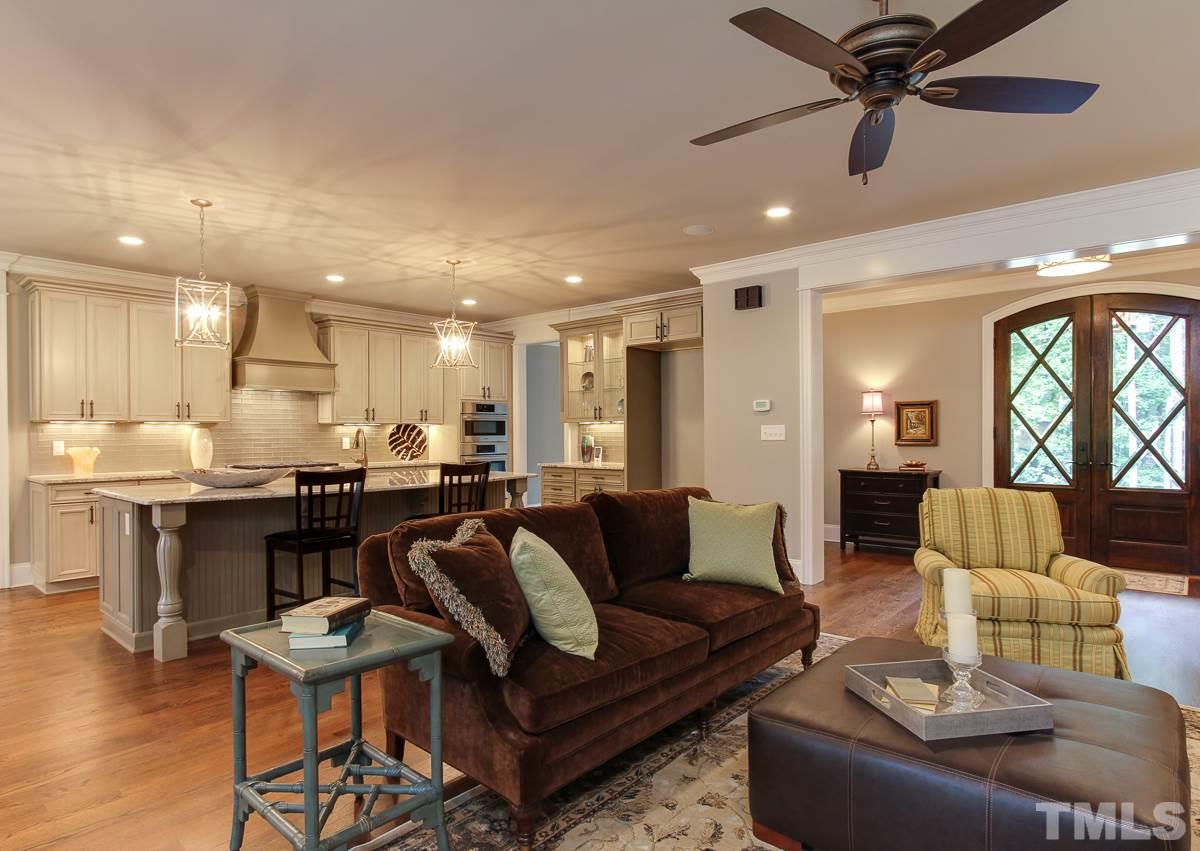 128 Chatterson Drive Raleigh, NC 27615 - Photo 6 of 25 a living room with furniture and kitchen view
