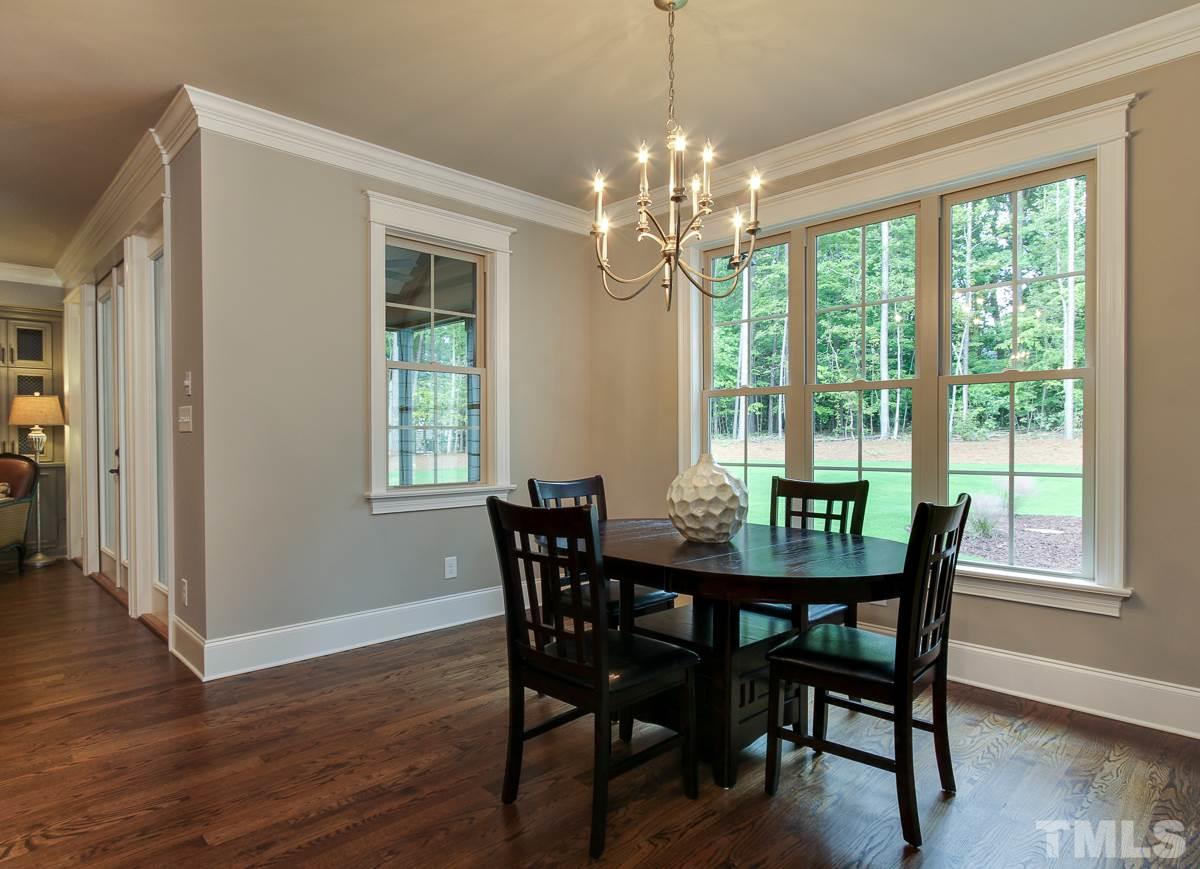 128 Chatterson Drive Raleigh, NC 27615 - Photo 10 of 25 a view of a dining room with furniture window and wooden floor