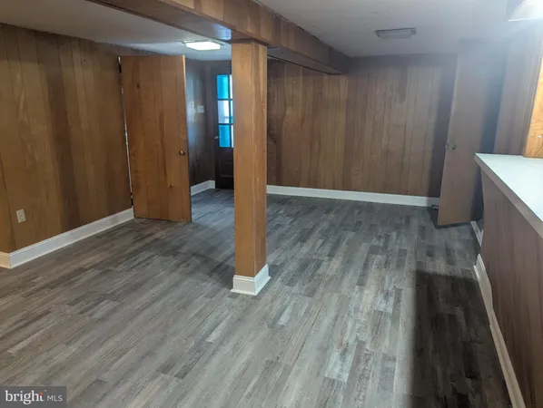 a view of hallway with wooden floor