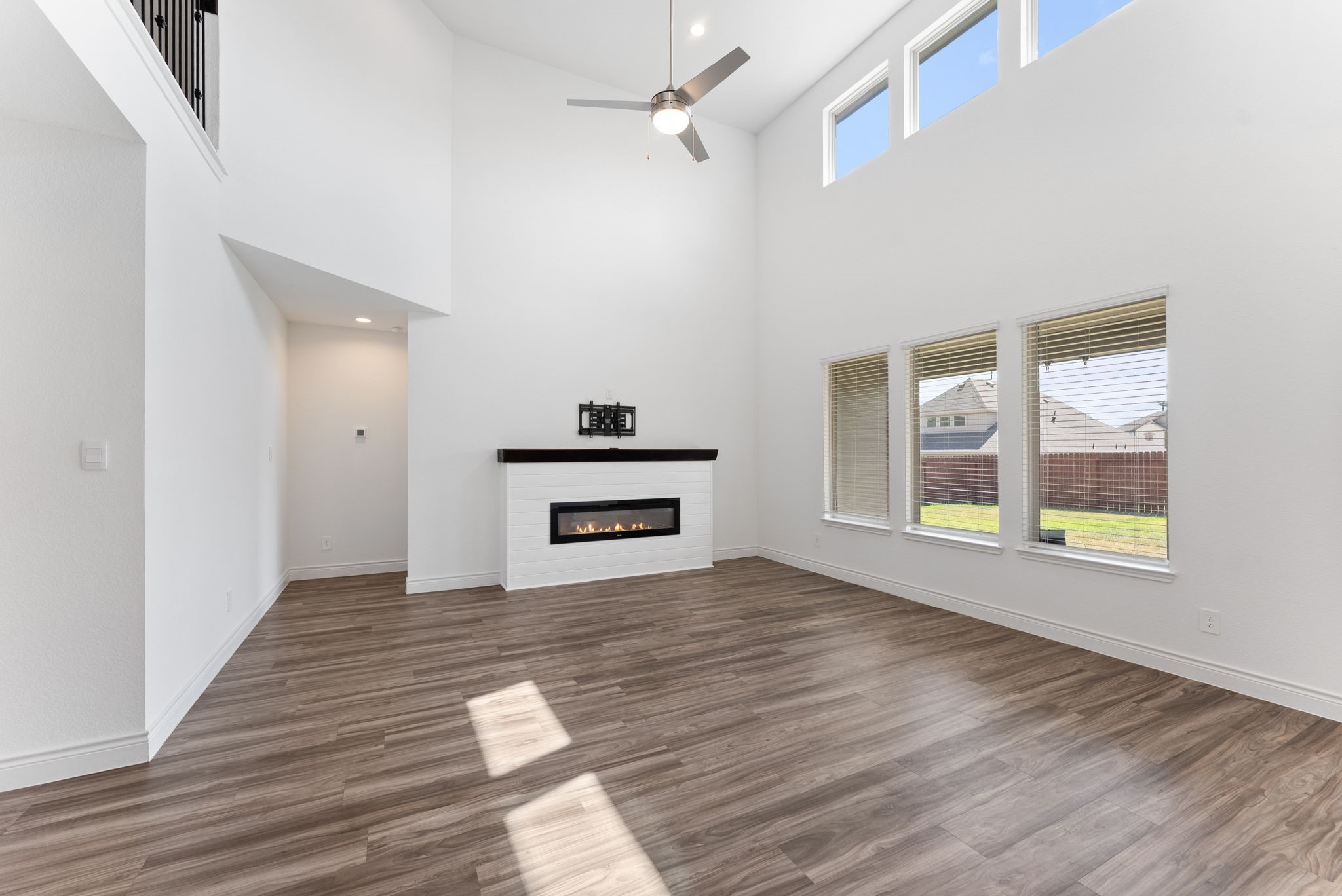20151 Clear Rdg Lane Montgomery, TX 77316 - Photo 11 of 39 a view of empty room with wooden floor and fan