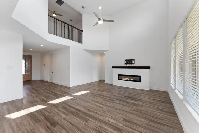 a view of kitchen and hallway with wooden floor
