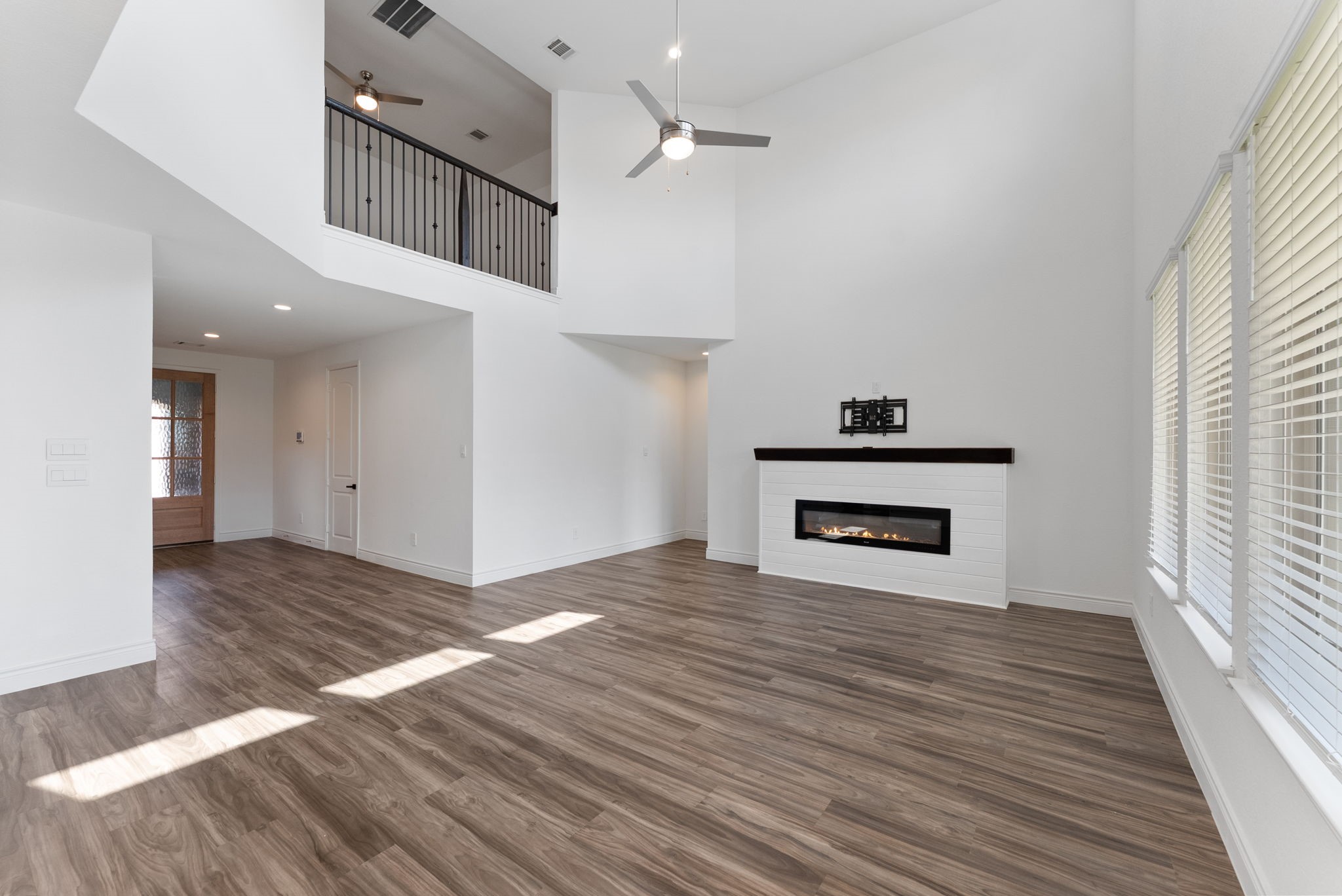20151 Clear Rdg Lane Montgomery, TX 77316 - Photo 12 of 39 a view of kitchen and hallway with wooden floor