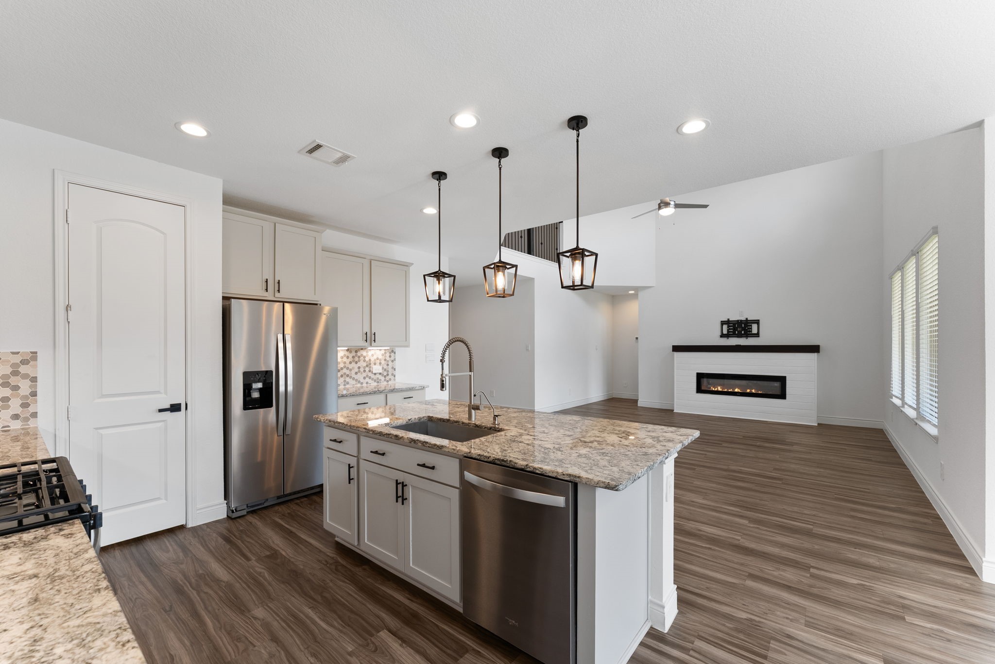20151 Clear Rdg Lane Montgomery, TX 77316 - Photo 16 of 39 a kitchen with stainless steel appliances kitchen island a refrigerator and a stove