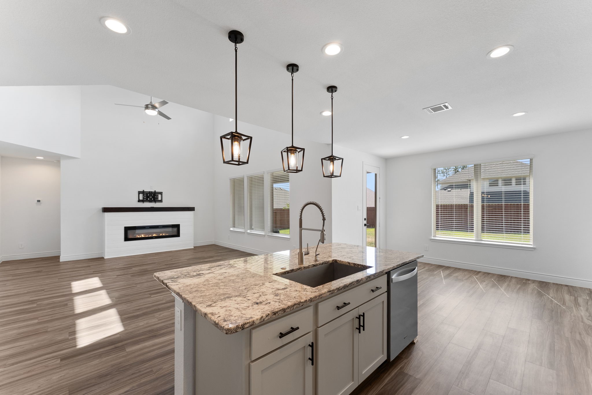 20151 Clear Rdg Lane Montgomery, TX 77316 - Photo 17 of 39 a kitchen with stainless steel appliances granite countertop a sink a oven a stove and a wooden floors