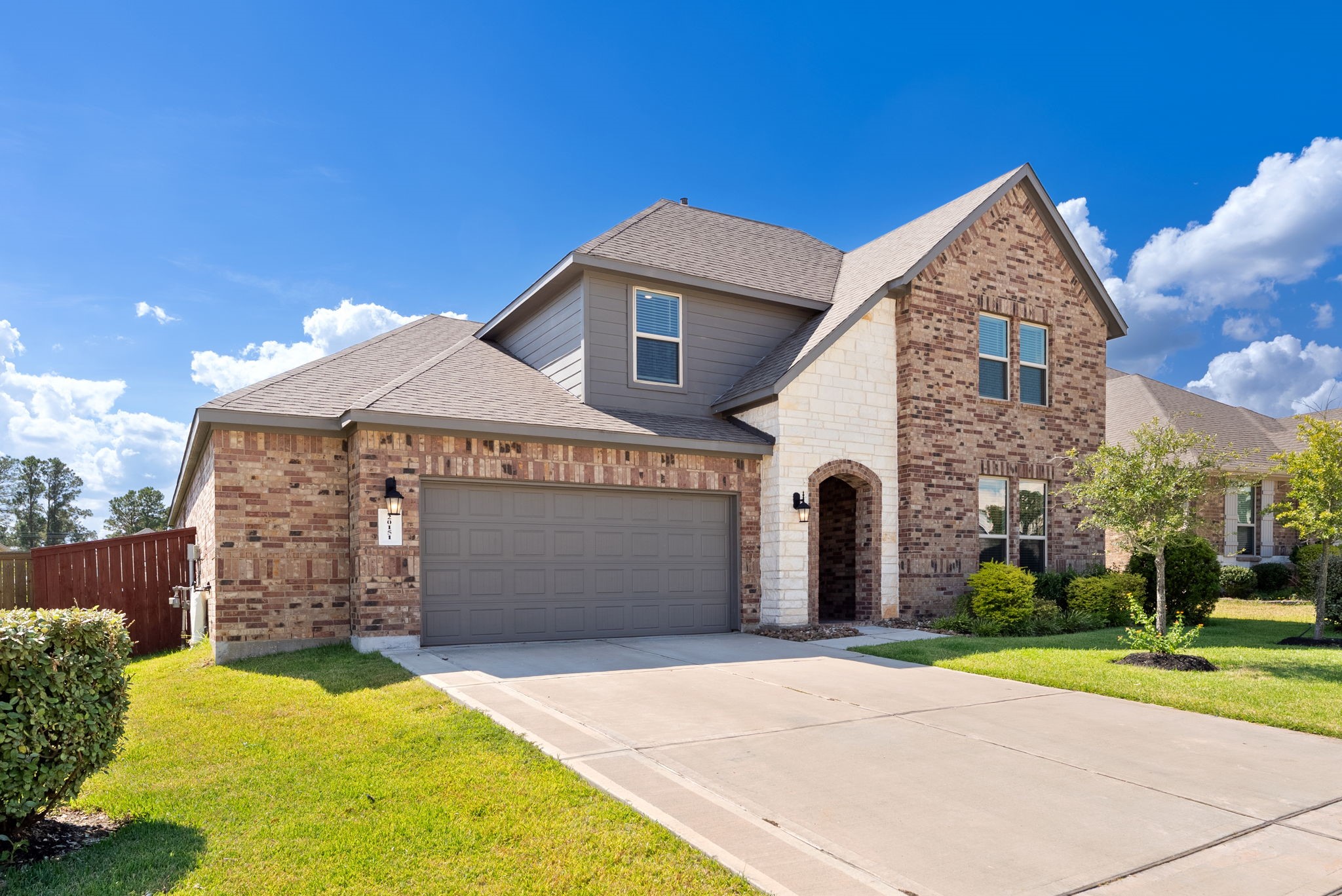 20151 Clear Rdg Lane Montgomery, TX 77316 - Photo 2 of 39 a front view of a house with garden