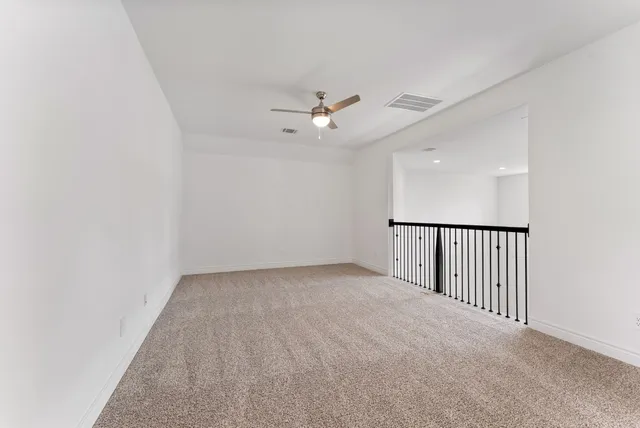 wooden floor in a hall with a window