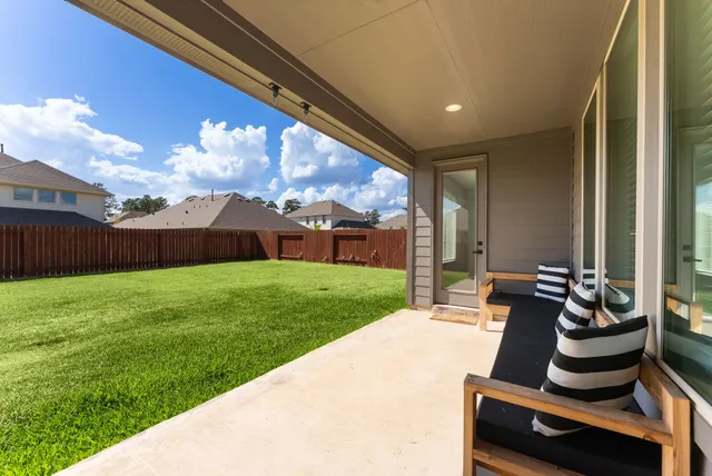 a view of an chairs and table in the patio