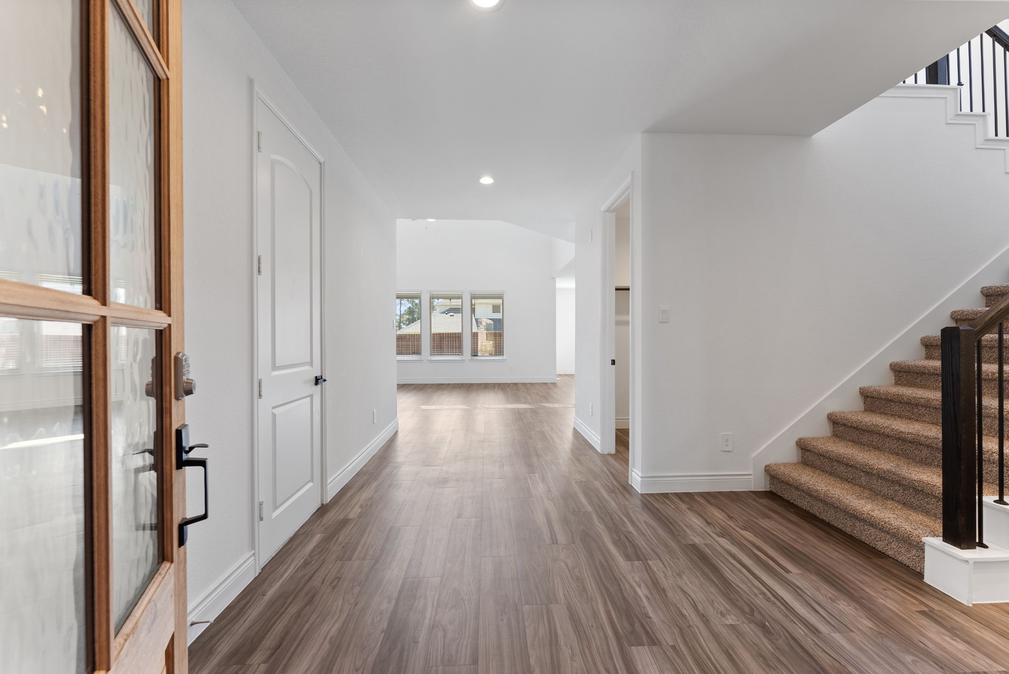 20151 Clear Rdg Lane Montgomery, TX 77316 - Photo 4 of 39 a view of a room with wooden floor and stairs