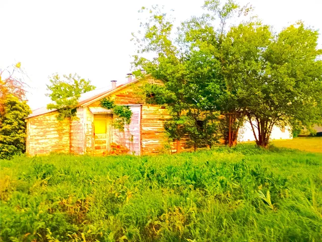 a view of yard with swimming pool