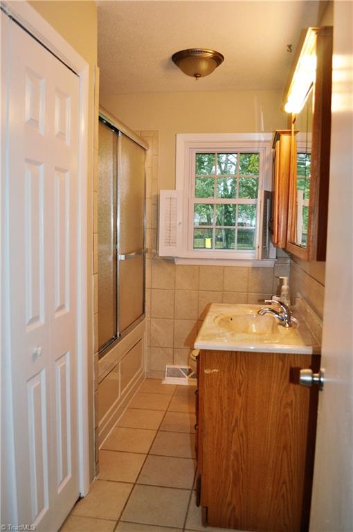 1411 West Meadowview Road Greensboro, NC 27403 - Photo 7 of 18 Full Bath and Laundry