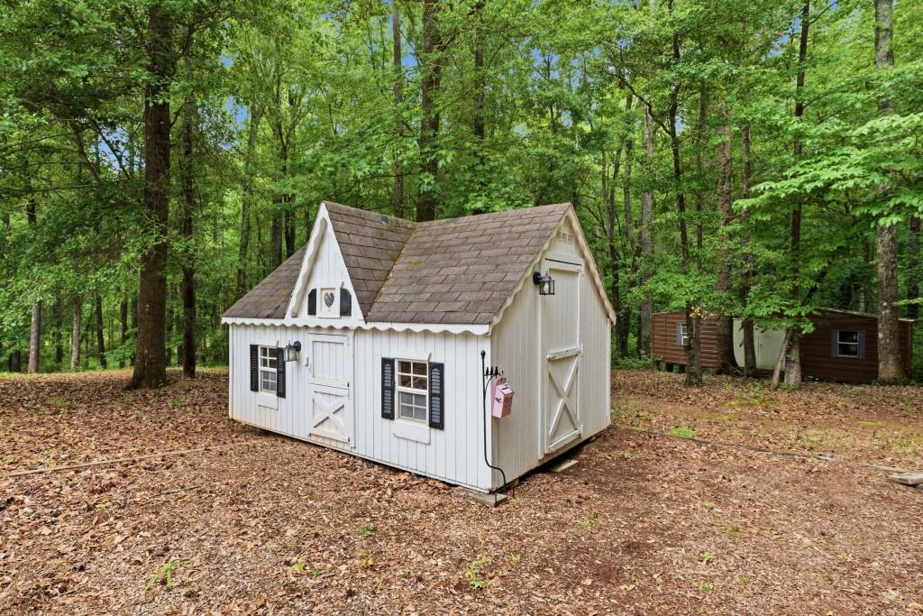 582 Knox Chapel Road Social Circle, GA 30025 - Photo 41 of 49 a view of a house with backyard and trees