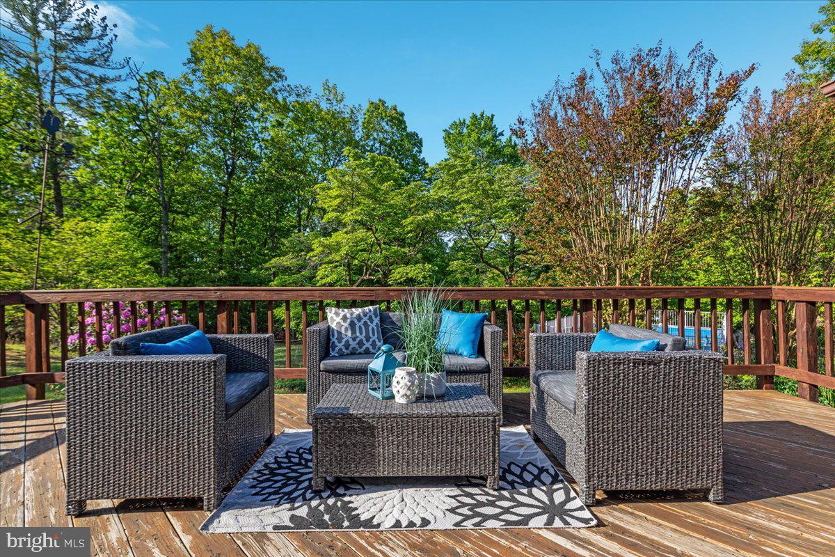 146 Lizzie Mills Road Castleton, VA 22716 - Photo 35 of 91 a balcony with wooden floor and furniture