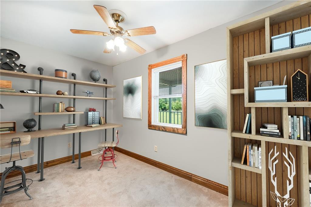 165 Vance Road New Castle, PA 16102 - Photo 17 of 39 a view of a workspace with furniture and a book shelf