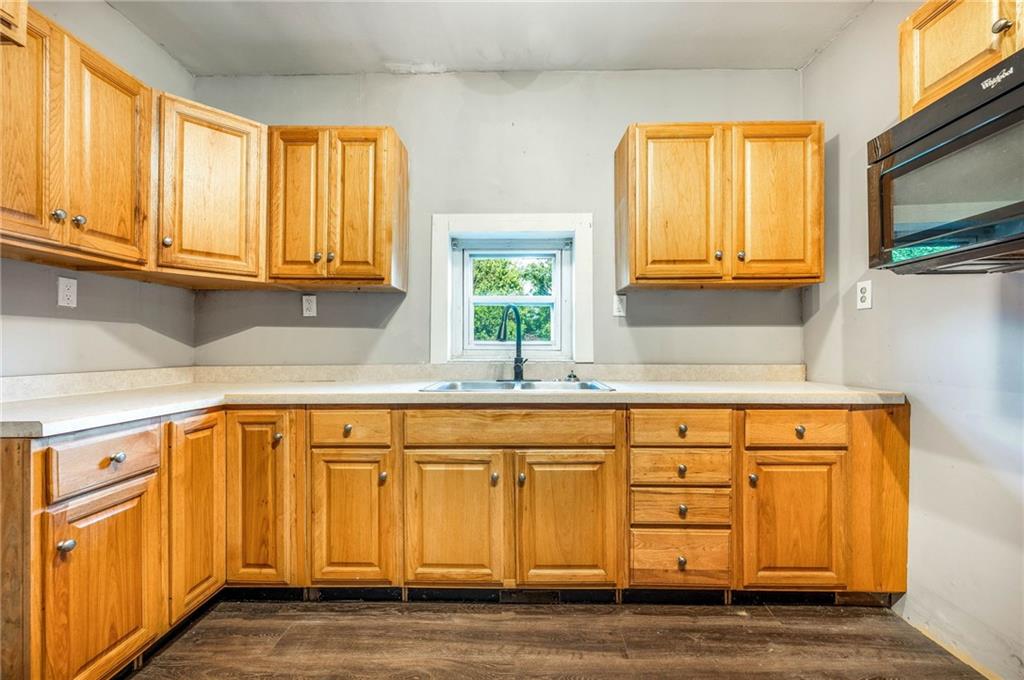 165 Vance Road New Castle, PA 16102 - Photo 26 of 39 a kitchen with stainless steel appliances granite countertop a sink and a granite counter tops with a window
