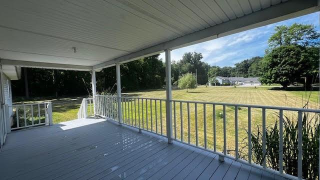 165 Vance Road New Castle, PA 16102 - Photo 3 of 39 a view of a balcony with floor to ceiling window and wooden floor