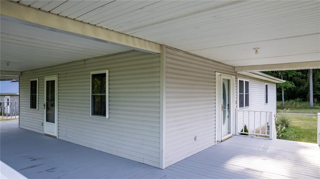 165 Vance Road New Castle, PA 16102 - Photo 5 of 39 a view of a house with wooden deck
