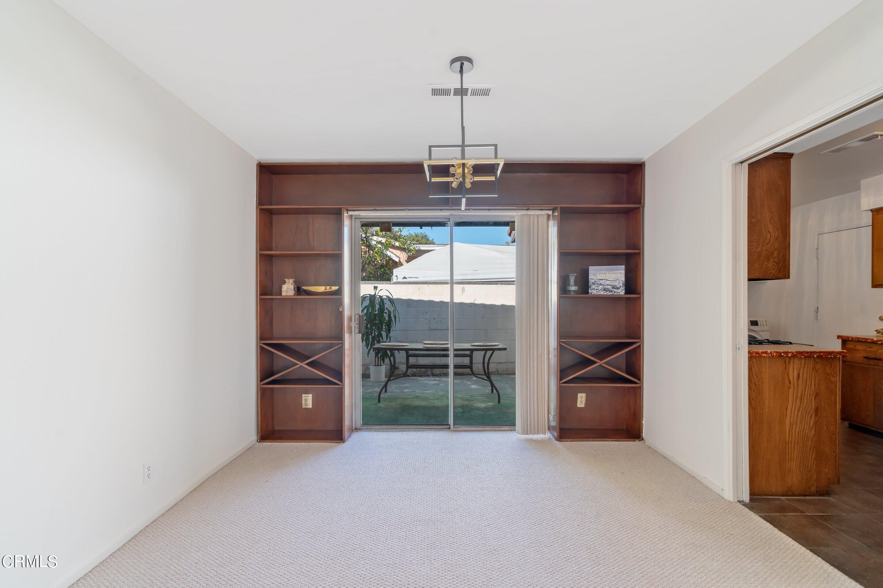 575 Winona Way Pasadena, CA 91103 - Photo 14 of 36 an empty room with furniture and windows
