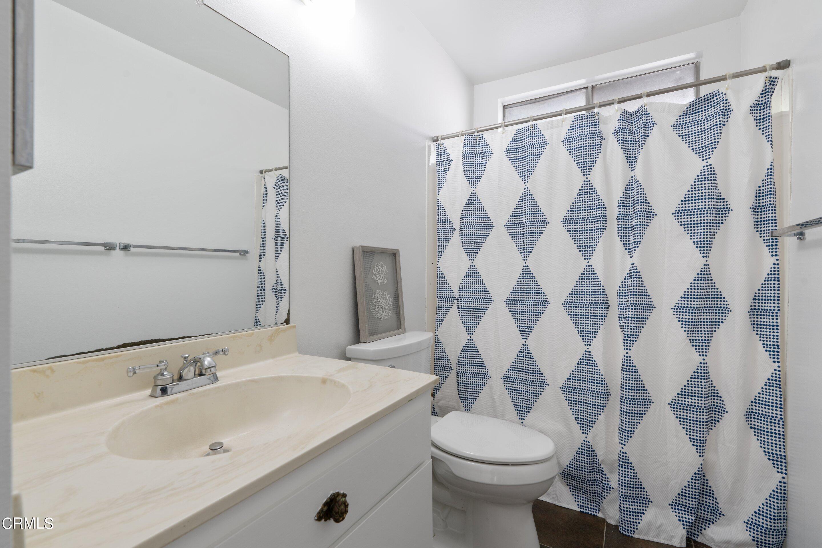 575 Winona Way Pasadena, CA 91103 - Photo 23 of 36 a bathroom with a sink and toilet