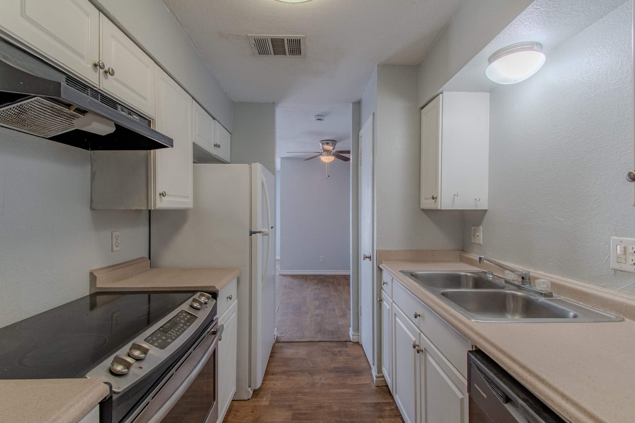 100 Uhland Road, Unit 3 San Marcos, TX 78666 - Photo 13 of 26 a kitchen that has a sink and a stove