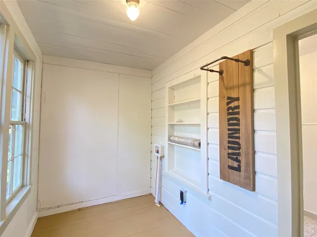 a view of walk in closet with window