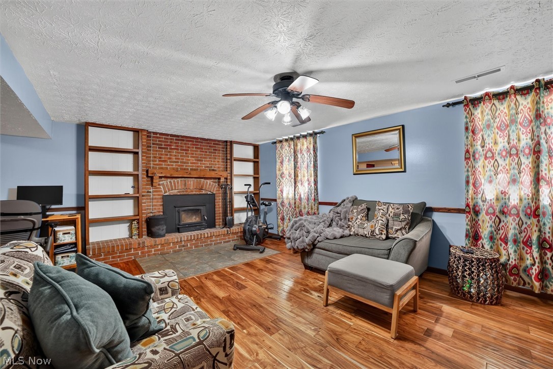 5862 Canterbury Road New Franklin, OH 44319 - Photo 23 of 45 Rec room with wood burning fireplace with insert.