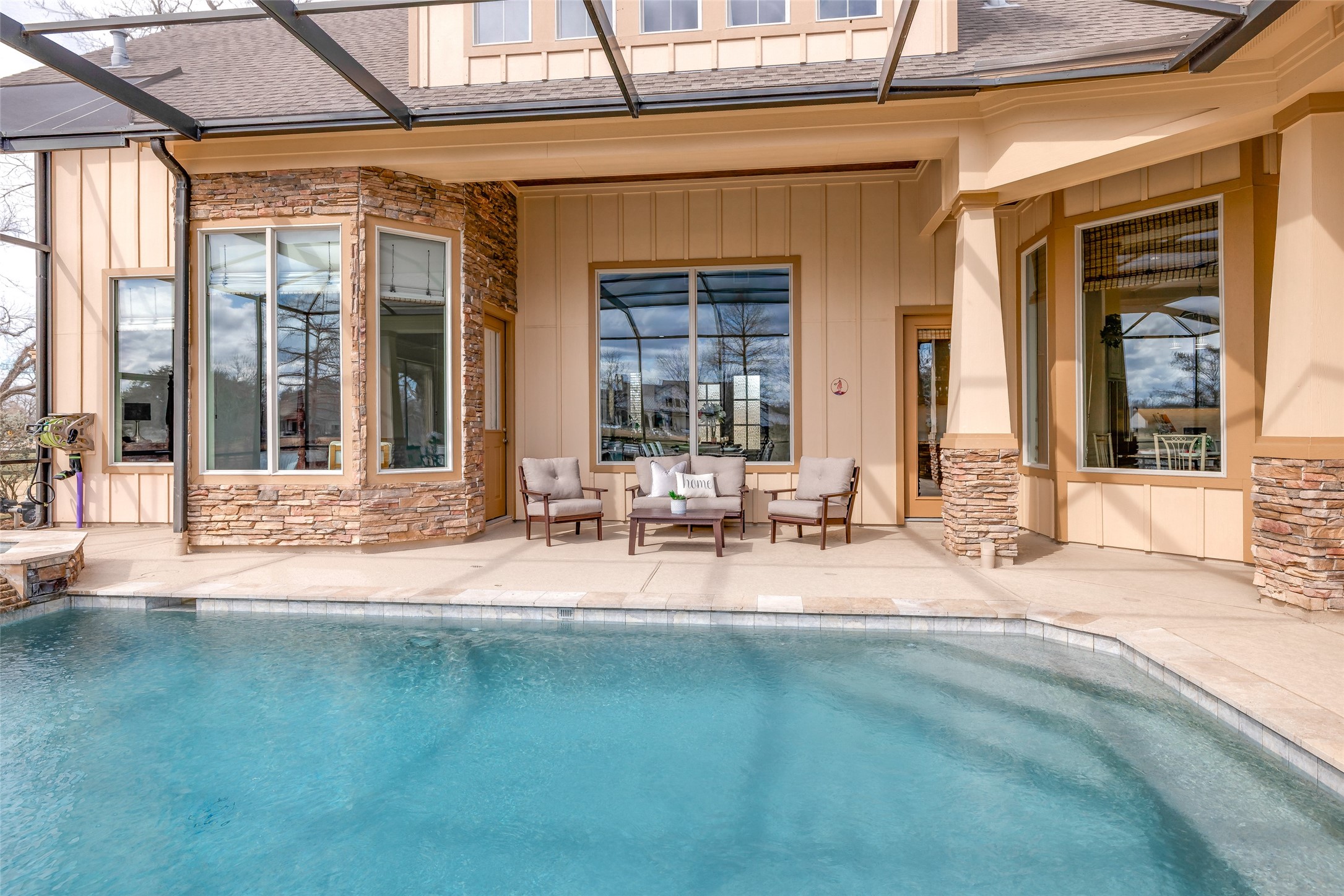 31102 Lower Oxbow Trace Fulshear, TX 77441 - Photo 43 of 50 Covered Patio with door access into the house, heated pool & spa