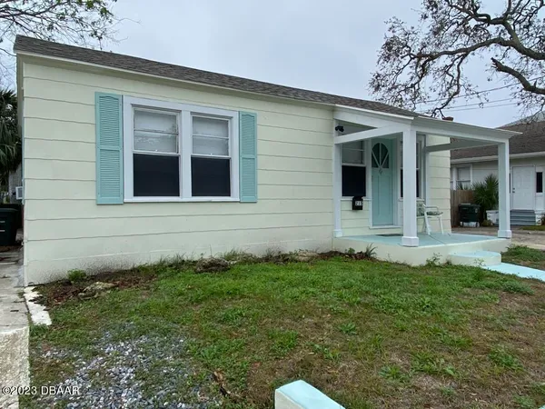 a view of front door and yard