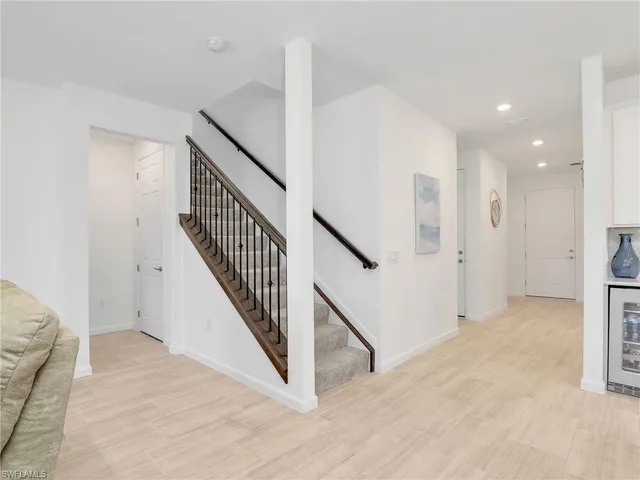 a view of a hallway with staircase