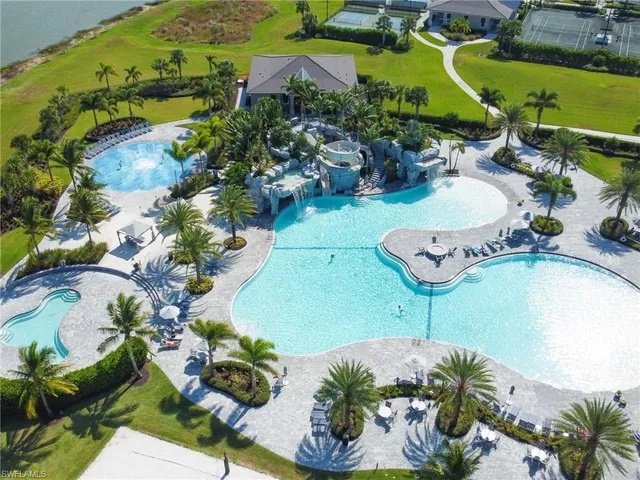 a view of a swimming pool with a yard