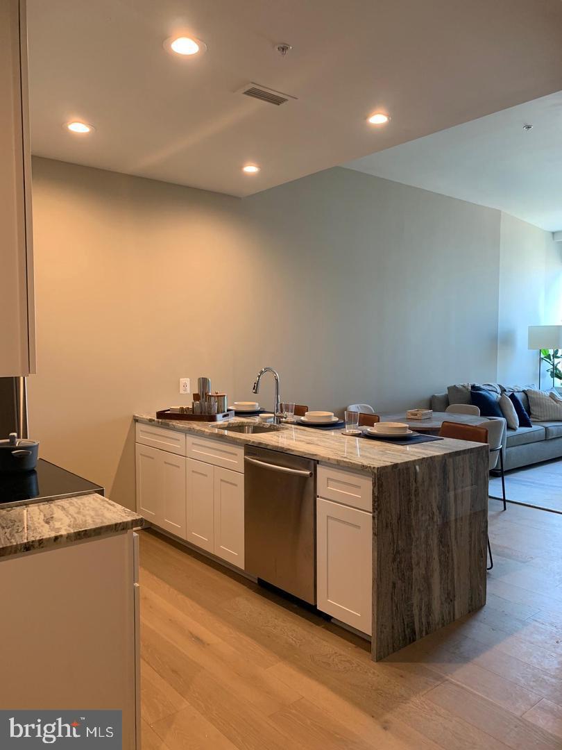 a kitchen with a stove and a sink