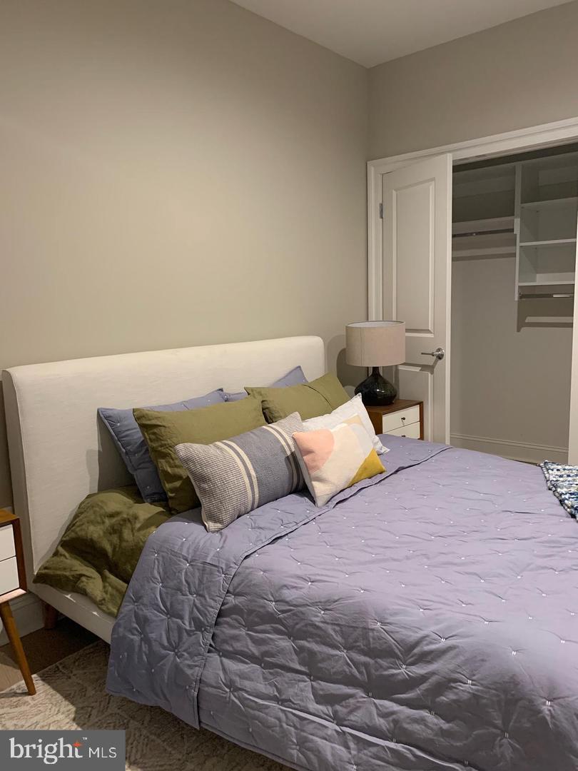 2130 Arch Street, Unit 103 Philadelphia, PA 19103 - Photo 10 of 25 a bedroom with a bed and window