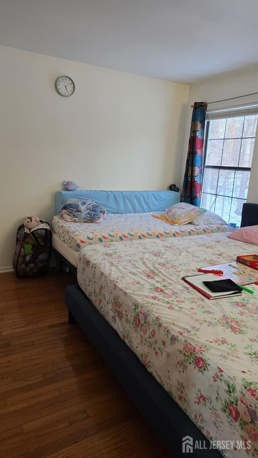 2805 Cricket Circle Edison, NJ 08820 - Photo 11 of 11 a bedroom with a bed and dresser