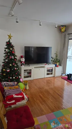 a room with furniture and a flat screen tv