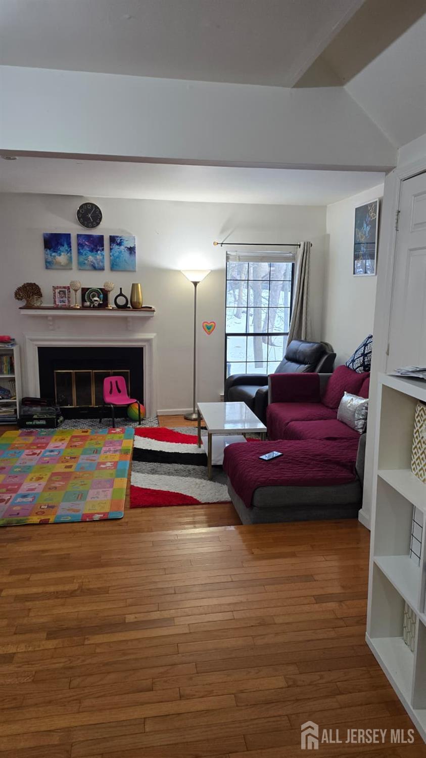 2805 Cricket Circle Edison, NJ 08820 - Photo 7 of 11 a living room with furniture flat screen tv and a fireplace