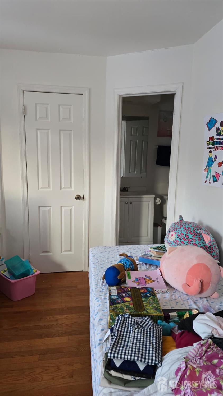 2805 Cricket Circle Edison, NJ 08820 - Photo 10 of 11 a bedroom with a bed and wooden floor