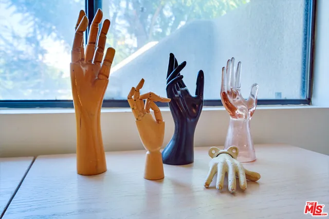 a view of walk in closet with clothes