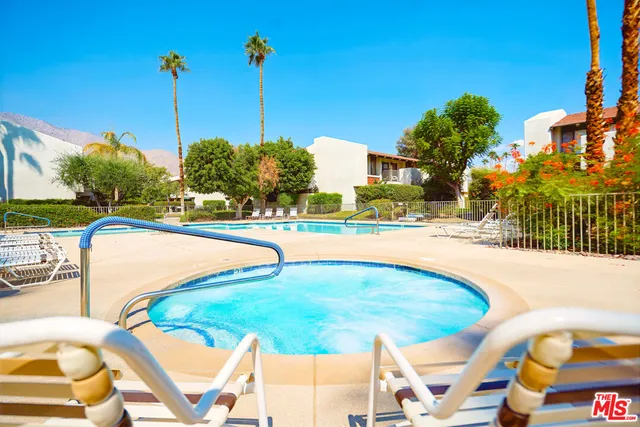 a view of a swimming pool with a patio