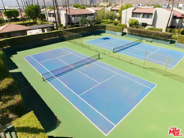 a view of an outdoor space and tennis court