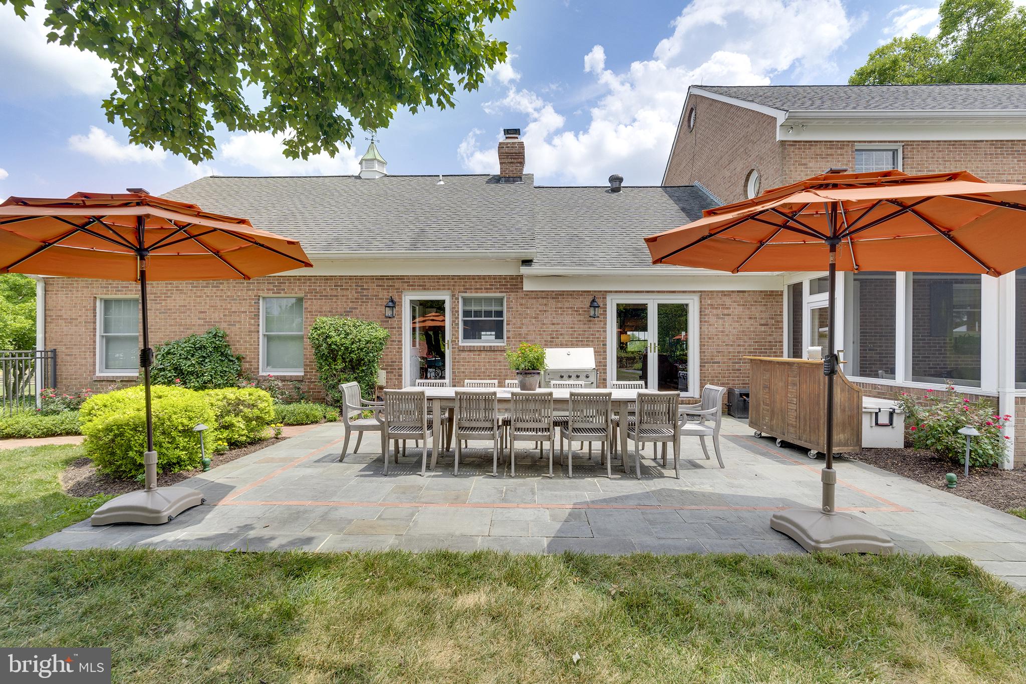 26100 Mullinix Mill Road Mount Airy, MD 21771 - Photo 69 of 99 Charming patio with vibrant umbrellas.