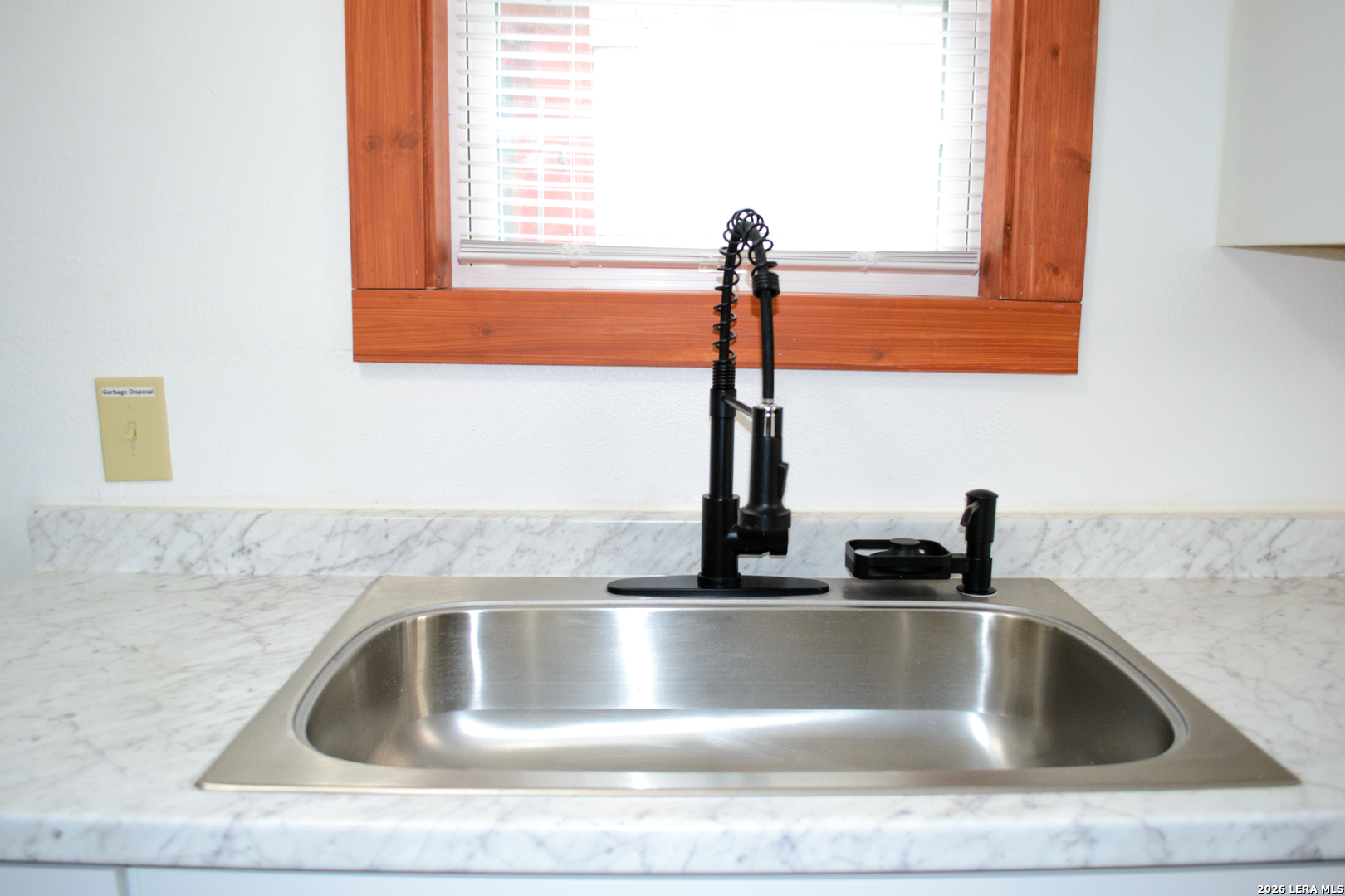 1406 Castroville Road San Antonio, TX 78237 - Photo 12 of 19 a kitchen with a sink and a window