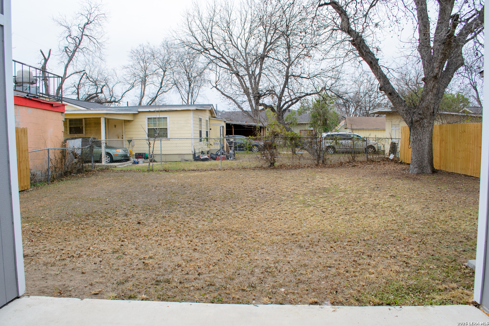 1406 Castroville Road San Antonio, TX 78237 - Photo 19 of 19 a view of a house with a yard covered in snow
