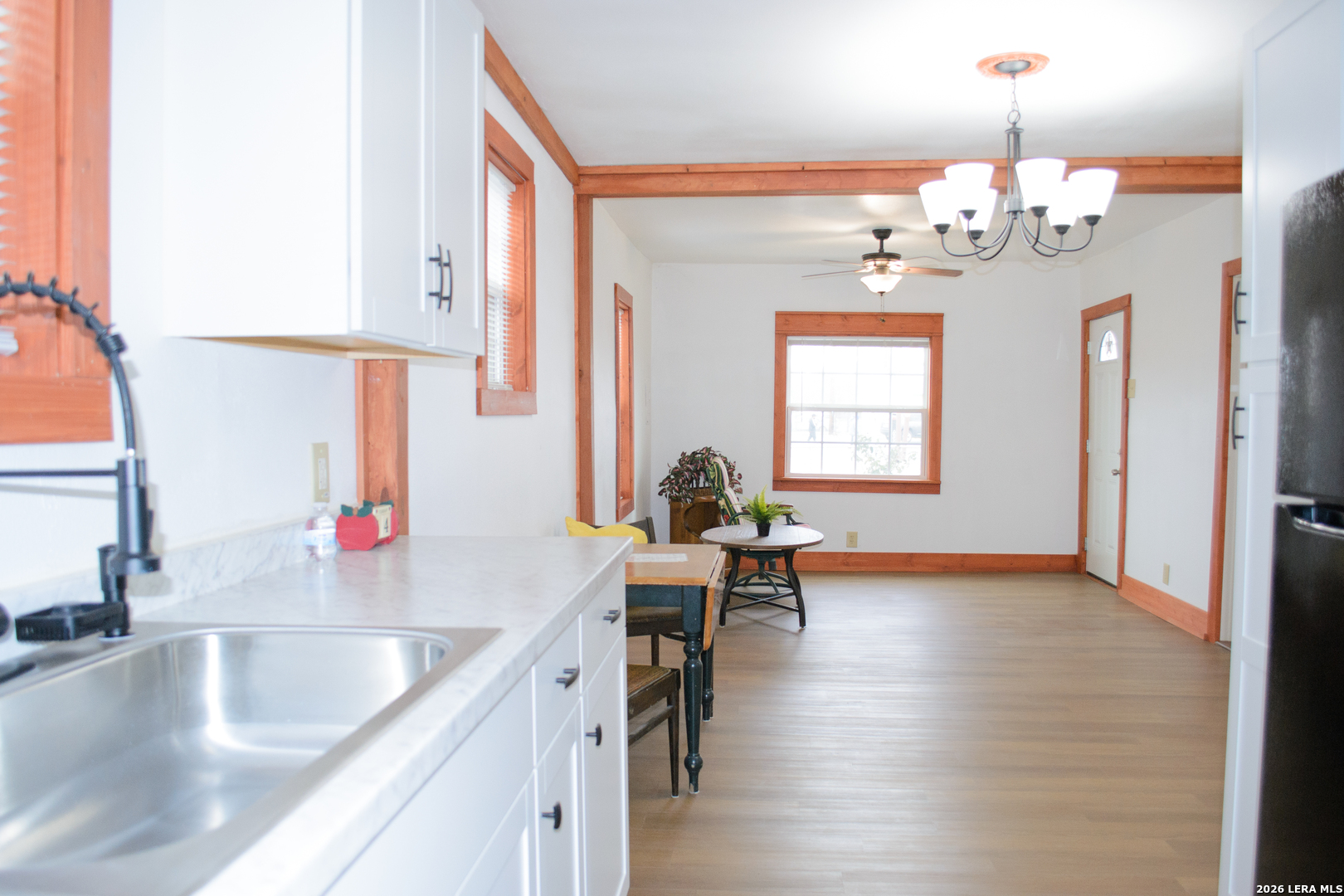 1406 Castroville Road San Antonio, TX 78237 - Photo 7 of 19 a kitchen with a sink dining table and chairs
