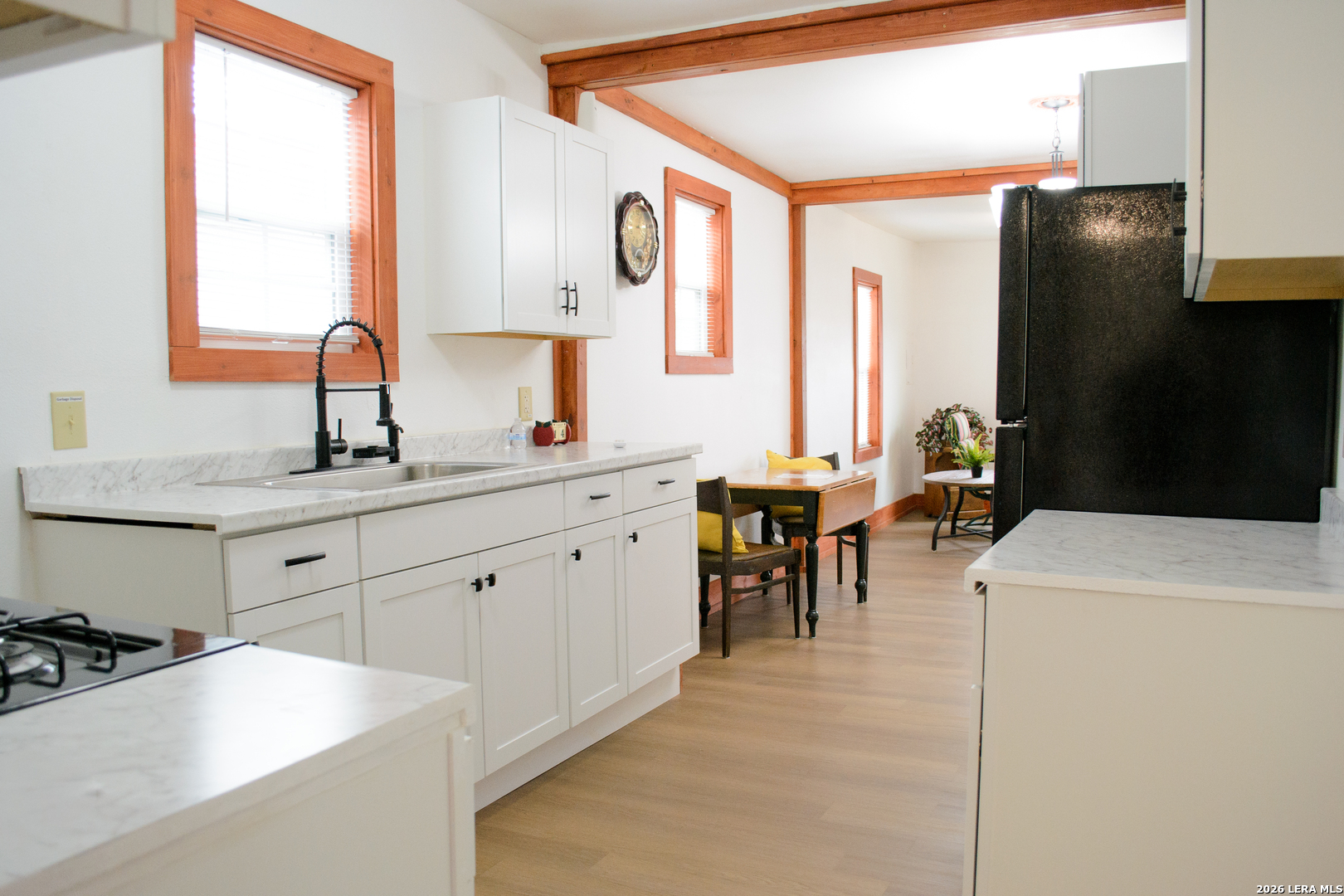 1406 Castroville Road San Antonio, TX 78237 - Photo 8 of 19 a kitchen with sink cabinets and window