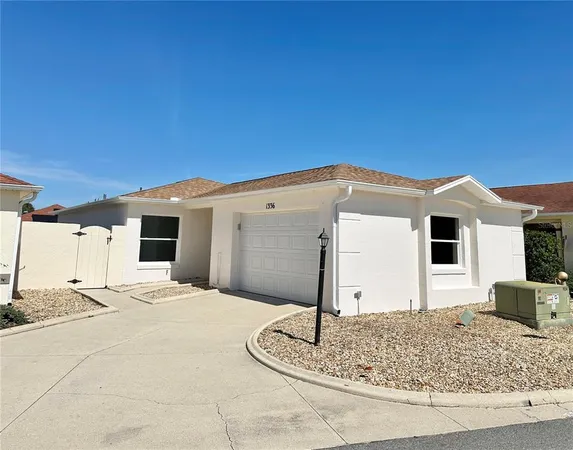 a front view of a house with a outdoor space