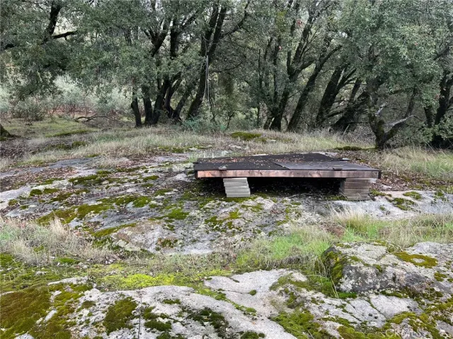 a backyard of a house with a yard and outdoor seating