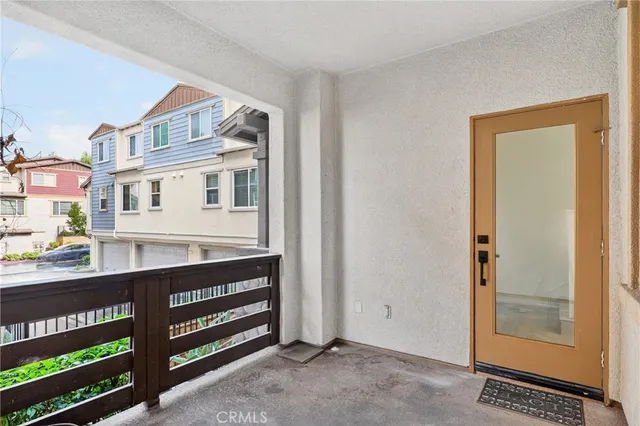a view of a room with wooden floor and cabinet