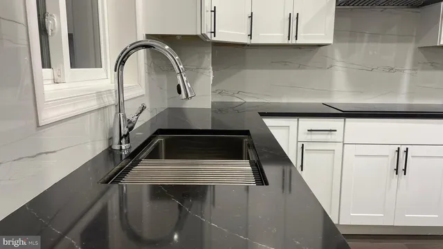a close view of sink and washing machine